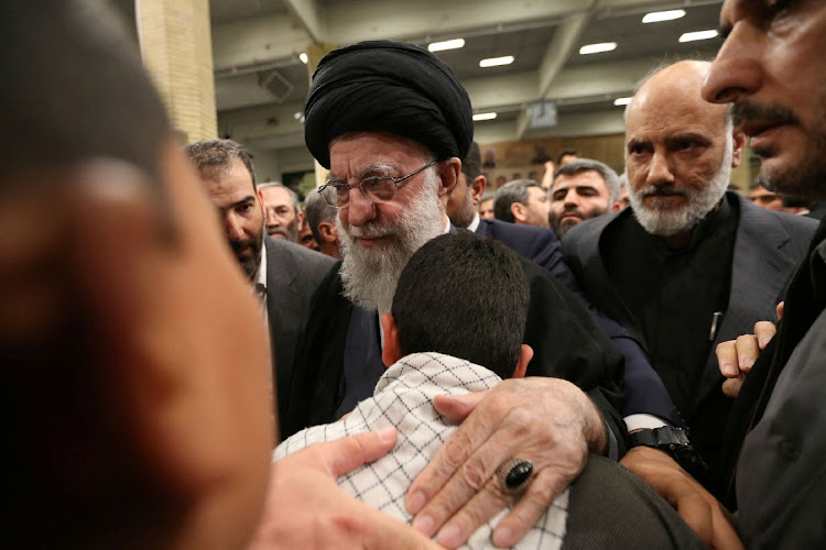 Iran's Supreme Leader, Ayatollah Ali Khamenei, meets with the family of one of the members of the Islamic Revolutionary Guard Corps who were killed in the Israeli airstrike on the Iranian embassy complex in the Syrian capital Damascus, during a funeral ceremony in Tehran, Iran April 4, 2024.