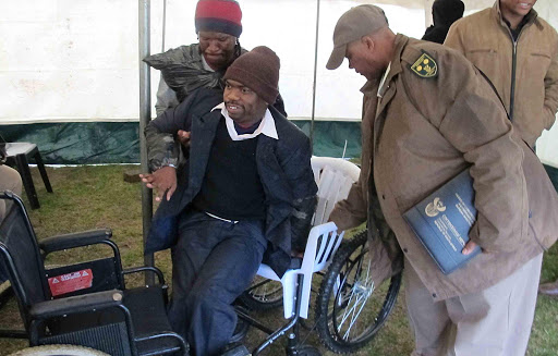 MOBILE: Ayanda Komani, aone of the physically challenged individual ins from the community, who received a new wheelchair from the East London correctional services yesterday as part of Mandela Day celebrations Picture: MARK ANDREWS