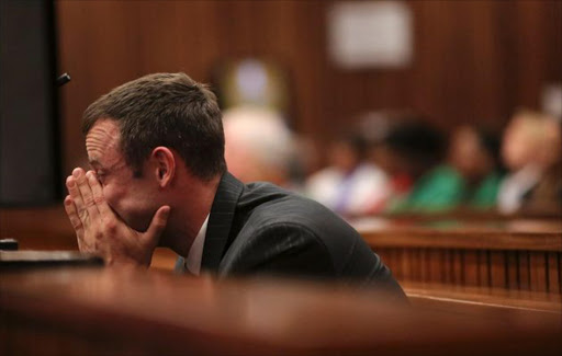 Olympic and Paralympic track star Oscar Pistorius reacts in the dock during his trial for the murder of his girlfriend Reeva Steenkamp, at the North Gauteng High Court in Pretoria. Image by: SIPHIWE SIBEKO / REUTERS
