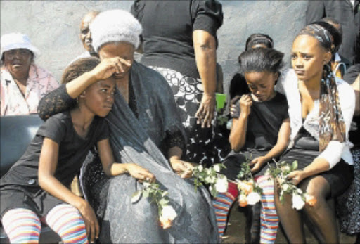 Nobantu Nogxolo and daughter Nomawethu Khuboni were at the memorial service of Thembeni Khuboni, a Metro policeman who was shot several times on his way to work in Pimville Zone 1. PHOTO: SIBUSISO MSIBI