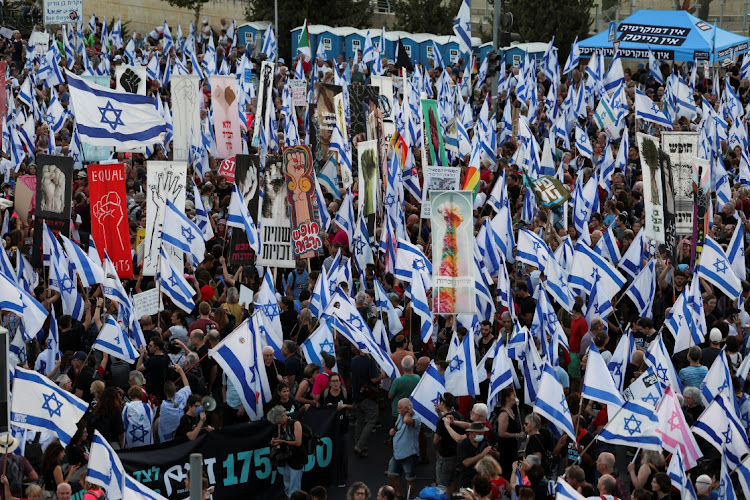 People take part in a demonstration against Israeli Prime Minister Benjamin Netanyahu and his nationalist coalition government's judicial overhaul ahead of an appeal against an amendment that curbs some powers of the Supreme Court, in Jerusalem, September 11, 2023.