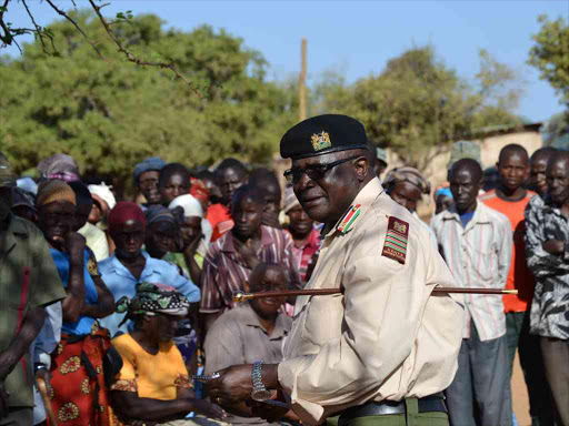 The Easter Region coordinator Wycliffe Ogolla addressing the residents of Kasiluni area in Ngomeni ward on Monday when he led the security team on a tour of the area. Photo by Musembi Nzengu