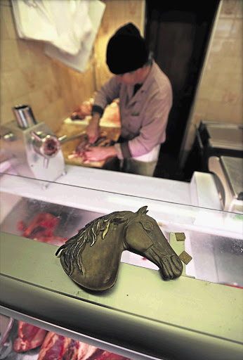 Charles Massa prepares horse meat in his horse butchery in the old city of Nice, France