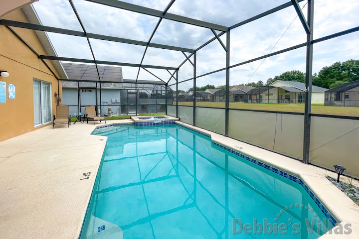 South-facing pool and spa at this Davenport vacation villa