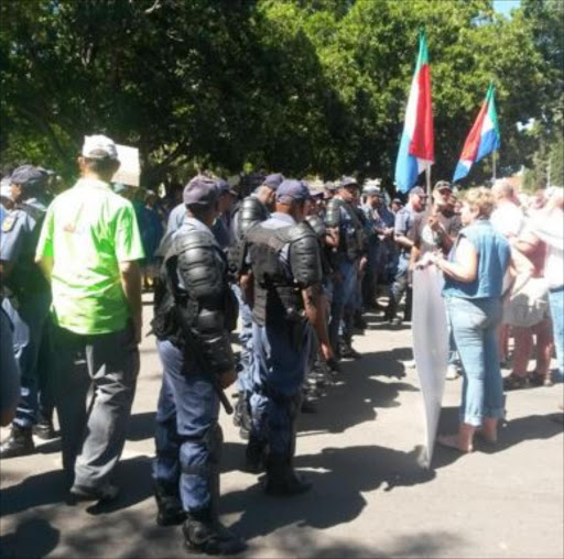 There was a heavy police presence outside the Parys Magistrate's Court when four farmers accused of killing two suspected farm attackers appearance. File photo