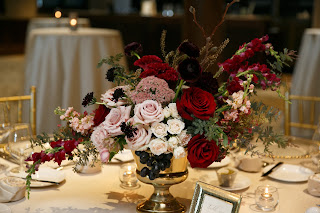 Image of rose centerpiece at wedding reception.