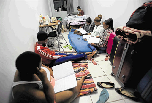 DESPERATE: Six UFH students who have not been allocated residence accommodation are sharing a single room at Elwandle residence. The university issued a notice this week that squatters should move out by 6pm on Wednesday Picture: SINO MAJANGAZA