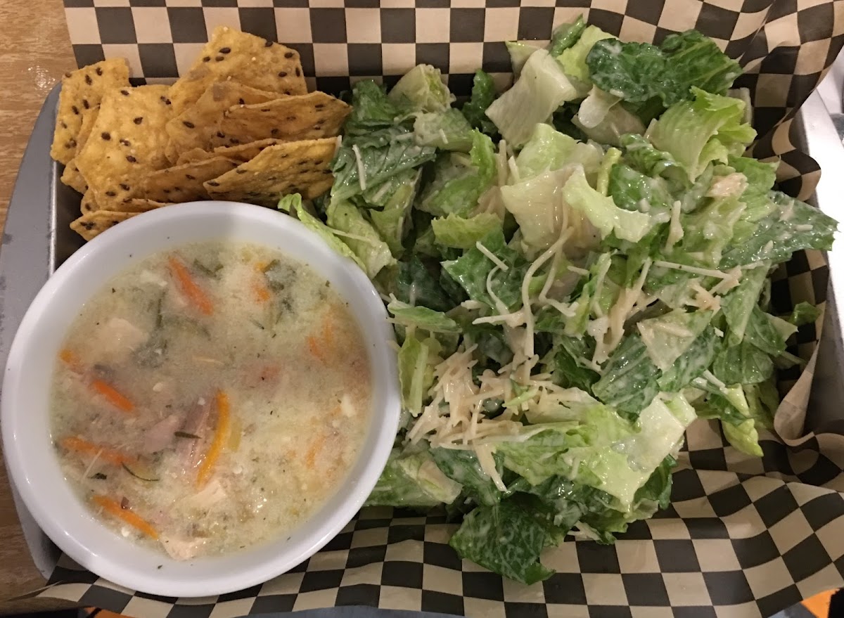 Cup of Lemon Chicken Soup and Caesar Salad and GF Taste So Good Chips.