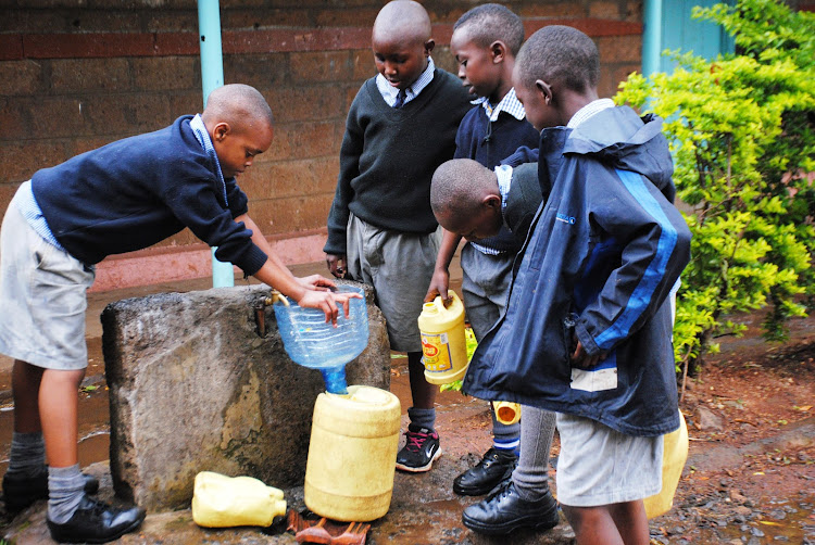 Pupils from Moi Avenue Primary School fetching water.