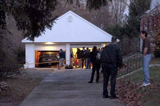 Authorities respond to a report of carbon monoxide poisoning in Toledo, Ohio, on Monday. The bodies of three children and two adults were found inside the garage Monday, and authorities said they believe the deaths — apparently from carbon monoxide poisoning -- weren't accidental. / Amy E. Voigt/The Blade