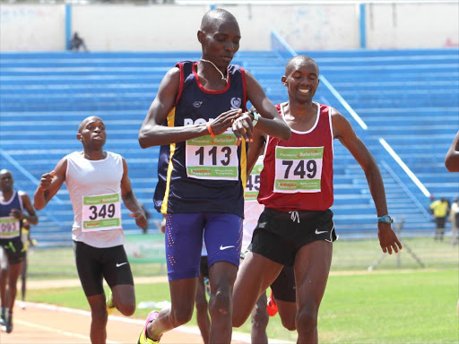 Asbel Kiprop stops his clock during the national athletics championships at Nyayo Stadium /ENOS TECHE