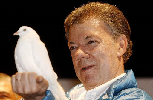 Colombian president Juan Manuel Santos holding a white pigeon during the closing of his campaing in Rionegro, Colombia. Santos has won the 2016 Nobel Peace Prize, the Royal Academy of Sciences in Stockholm, Sweden, announced on 07 October 2016. EPA/LUIS EDUARDO