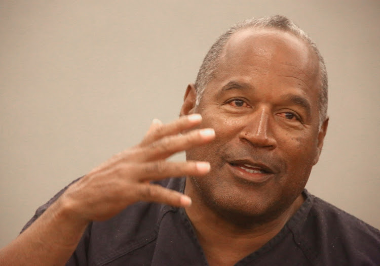 OJ Simpson testifies during an evidentiary hearing in Clark County district court in Las Vegas, Nevada, on May 15 2013. He has died of cancer at the age of 76. File photo,