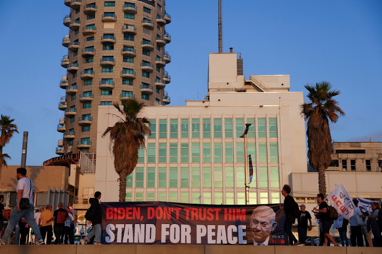 People hold a banner outside the US Embassy during a protest in support of US President Biden after Iran launched drones and missiles towards Israel, in Tel Aviv, Israel, on April 15 2024.