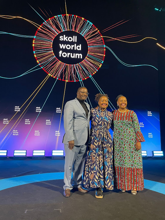 Founder and Executive Director Food for Education Wawira Njiru with her parents when she received the Social Innovator Award by Skoll Foundation in Oxford, England on April 12, 2024.