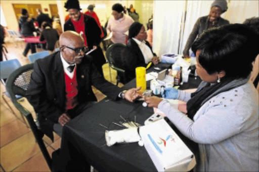 HEALTH CHECKLIST: Congregants of Tembisa Methodist Church receiving health tests PHOTO: VATHISWA RUSELO