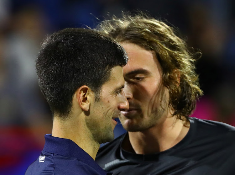 Serbia's Novak Djokovic and Greece's Stefanos Tsitsipas after their semi final match at the Abu Dhabi International Tennis Complex, Abu Dhabi, United Arab Emirates - December 20, 2019