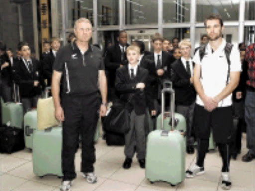 WELCOME: The New Zealand team after their arrival at the OR Tambo International Airport yesterday morning are greeted by the Drakensberg Boys Choir. Head coach Ricki Herbert and captain Tim Brown pose for the media. Pic. Chris Ricco. 04/06/2009. © Backpagepix The New Zealand team arrived in South Africa this morning and were greeted by the Drakensberg boys choir. Head coach Ricki Herbert and captain Tim Brown pose for a picture with the Drakensberg Boys Choir. ©Chris Ricco/Backpagepix.