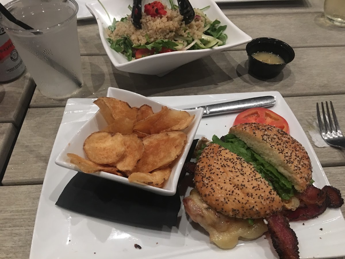 Gluten free bun with the chicken sandwich, chips and a salad