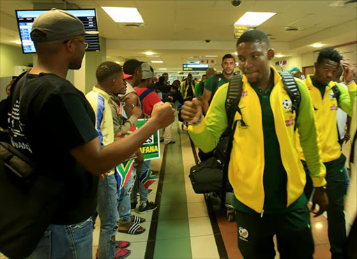 TOUCH DOWN: Bafana Bafana players were greeted by fans at the East London airport today. Picture: SINO MAJANGAZA