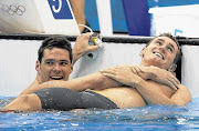 WORLD RECORD SMILE: Cameron van der Burgh, right, celebrates with Christian Sprenger of Australia after winning Olympic gold Picture: GETTY IMAGES