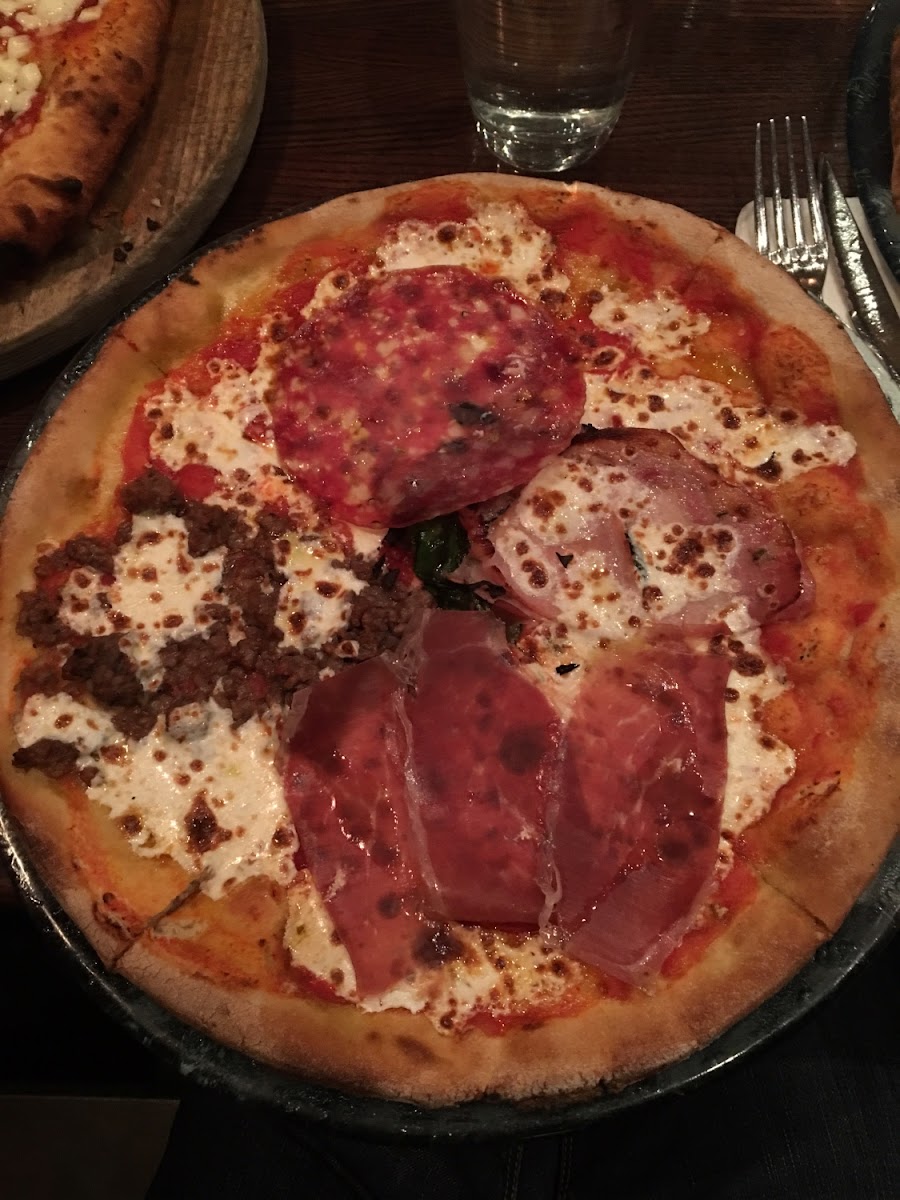 I paid around $25 for this GLUTEN FREE pizza that was the best pizza I have ever eaten. I've only been gluten free a year but this is hands sounds bar none the best I have ever tasted, Gluten or non gluten! This one was called The Butcher and It was 4 different types of meat. They had other less expensive pizza...