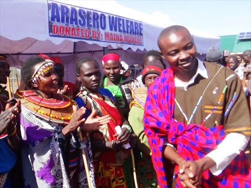 Laikipia North constituency MP aspirant Maina Munene join Arasero women group where he donated tents and chairs on Wednesday. The IEBC has banned politicians from conducting harambees until after the next general elections.