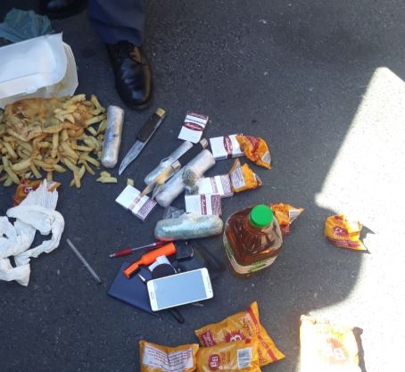Constable found in possession of 329 grams of dagga, 2 knives, bottle of whiskey, cigarettes, tobacco, & various other forms of contraband which were to be smuggled in prisoners.