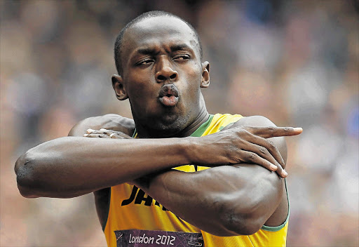 Jamaica's Usain Bolt showboats ahead of his 200m heat at the Olympics yesterday