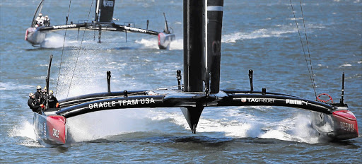 FULL STEAM AHEAD: Oracle Team USA sails towards the finish line ahead of Emirates Team New Zealand to win Race 17 of the 34th America's Cup yacht race in San Francisco, California. Oracle was trailing 8-1 before turning its fortunes around Picture: