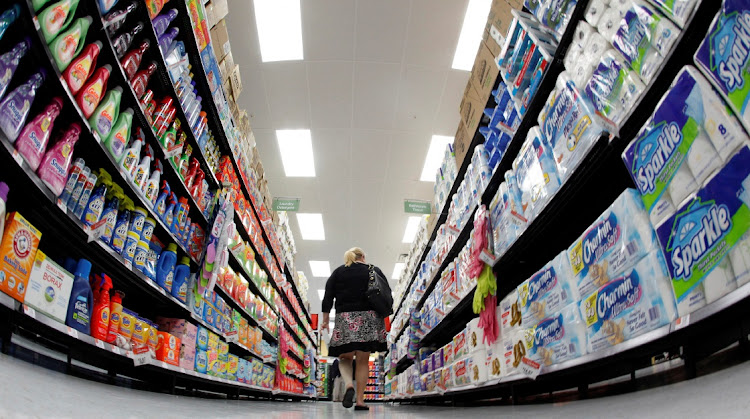 A shopper walks down an aisle at a Walmart store in Chicago, the US. Picture: JIM YOUNG/REUTERS