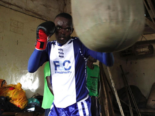 Kenyan flyweight boxer Benson Gicharu goes through routine training at Kariobangi Social Hall. /FILE