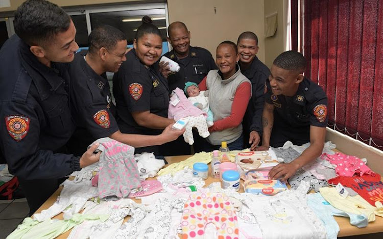 Firefighter Liesl George led a drive to collect baby clothes and products for the month-old infant.