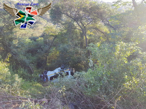 Twelve children were injured when the taxi transporting them to school collided with a car and rolled down an embankment.