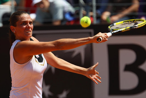 Roberta Vinci of Italy plays a backhand during first round match against Sara Errani of Italy during day three of the Internazoinali BNL D'Italia at the Foro Italico Tennis Centre on May 10, 2011 in Rome, Italy