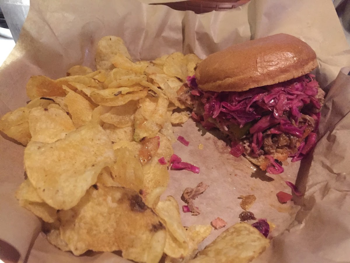 Bbq pulled pork sandwich with red cabbage and  chips