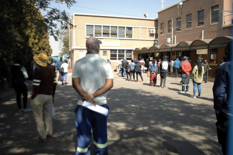 People standing in queues at the Langlaagte drivers and learners licence testing centre in Amalgam, Johannesburg.