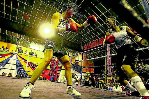 Sharrodene Fortuin, right, prepares to unleash a left hook on Maria Rivera of Argentina during their fight for the vacant world IBO female bantamweight title in this file picture. On Saturday, Fortuin won her fight against Brazilian Simone Da Silva in East London.Photo: SIBONGILE NGALWA