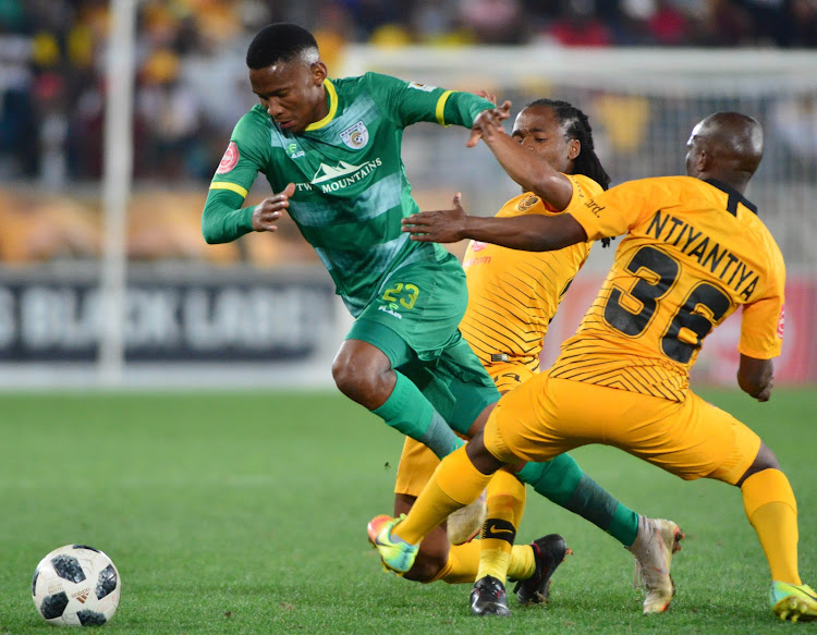 Baroka FC's Mpho Kgaswane gets away from a challenge from Siphosakhe Ntiyantiya and Siphiwe Tshabalala of Kaizer Chiefs during the Absa Premiership match at Peter Mokaba Stadium in Polokwane the on August 14 2018.