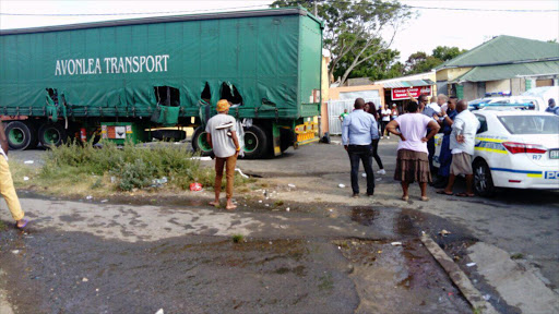 A battery truck was looted in Southernwood, East London this morning. Looters ran off with more than R800K worth of merchandise Picture: ZOLILE MENZELWA