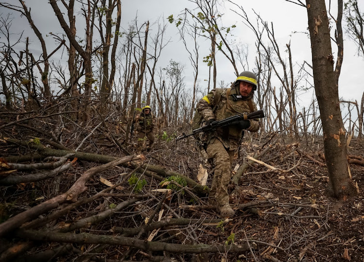 Ukrainian servicemen check Russian positions after a fight as Russia's attack on Ukraine continues near the front line city of Bakhmut, in Donetsk region, Ukraine, on May 11 2023.
