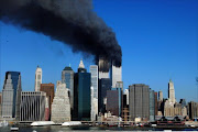 The twin towers of the World Trade Center billow smoke after hijacked airliners crashed into them early September 11 2001. The terrorist attack caused the collapsed of both towers. File photo.