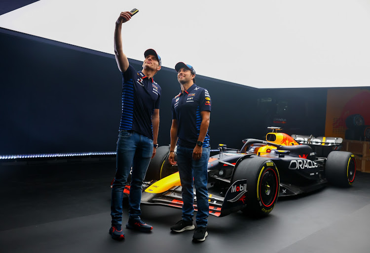 Mas Verstappen and Sergio Perez take a selfie with the new RB20 car. Picture: RED BULL