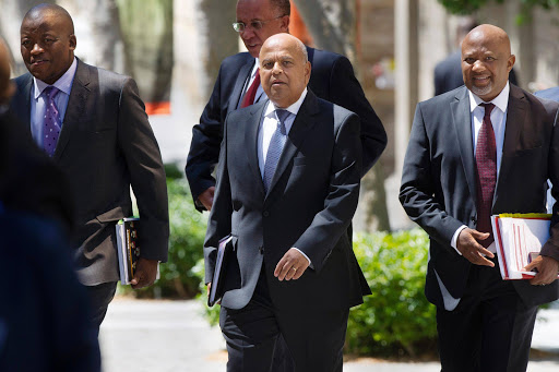 Minister of Finance Pravin Gordhan arrives with members of the Natioanl Treasury Lungisa Fuzile and Mcebisi Jonas to present his 2016 Budget Vote Speech in the National Assembly. Picture Credit: Gallo Images