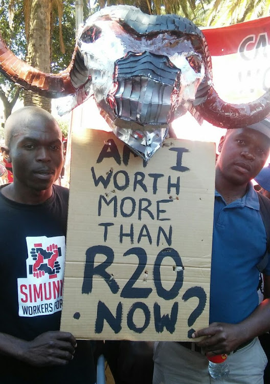 Khongelani Hlongwane and Thabang Mohlala of the Casual Workers Advice Office during the march against the minimum wage in Newtown, downtown Johannesburg.