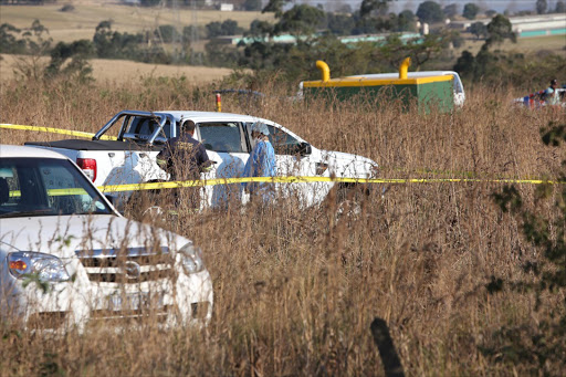 Police at the scene where a taxi boss who was shot , lost control of his Ford ranger and veered off the N3 where he died killing a child pedestrian as he lost control Picture: Jackie Clausen