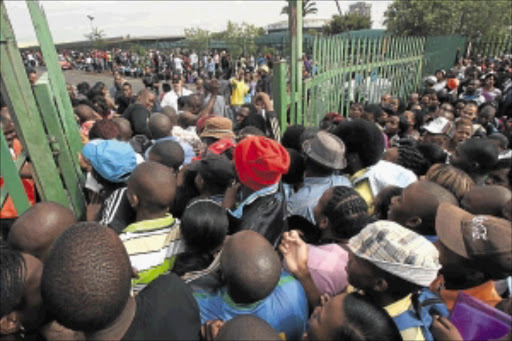 DESPERATE: There were long queues and chaos yesterday when prospective students forced their way on to the University of Johannesburg campus in Auckland Park to register for this year's studies. PHOTOS: ANTONIO MUCHAVE