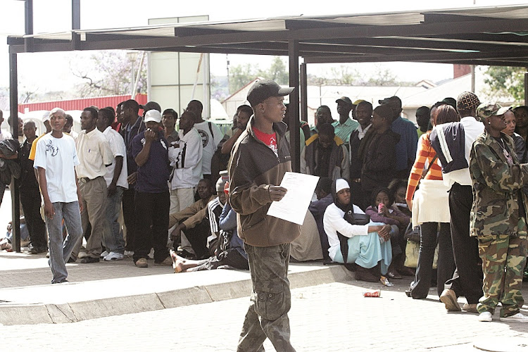 File photo of refugees queuing for asylum permits at Pretoria's home Affairs Department.