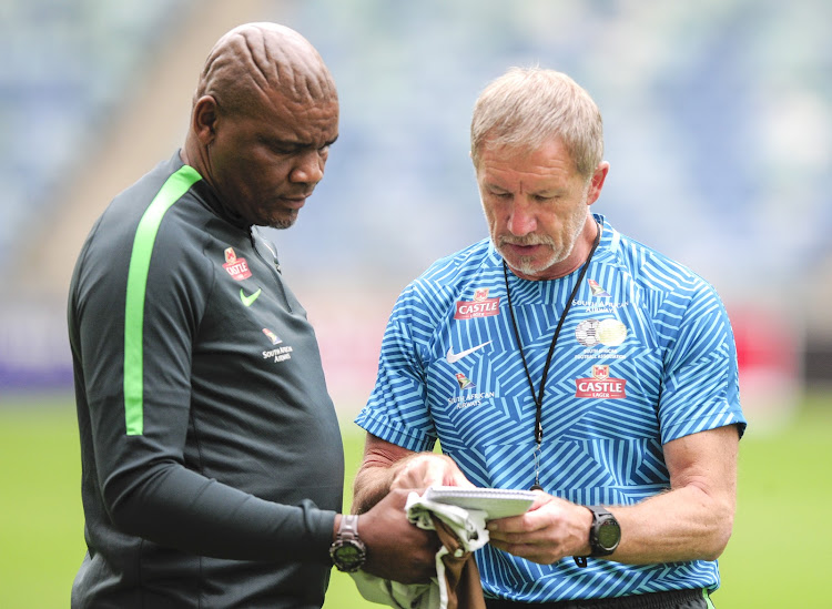 Bafana Bafana coach Stuart Baxter (R) in a discussion with his assistant Molefi Ntseki (L) during the national team's training session at Moses Mabhida Stadium on September 6 2018.