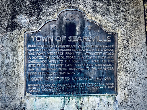 Here stood the lumbermen's village of Searsville whose first settler, John Sears, arrived in 1854. Across the road, west of this monument, stood a hotel. The school, store, blacksmith shop, and...